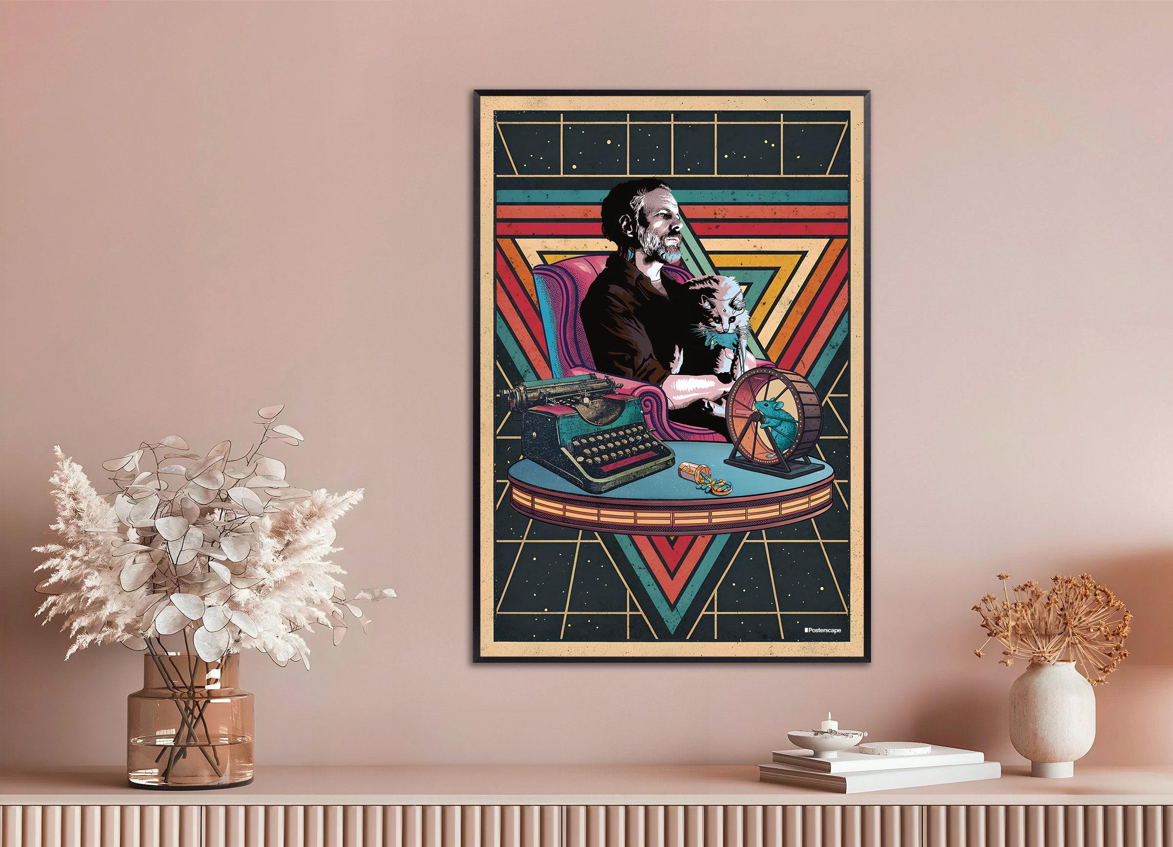 Framed poster of the writer Philip K. Dick with a cat on a desk against a pink wall.