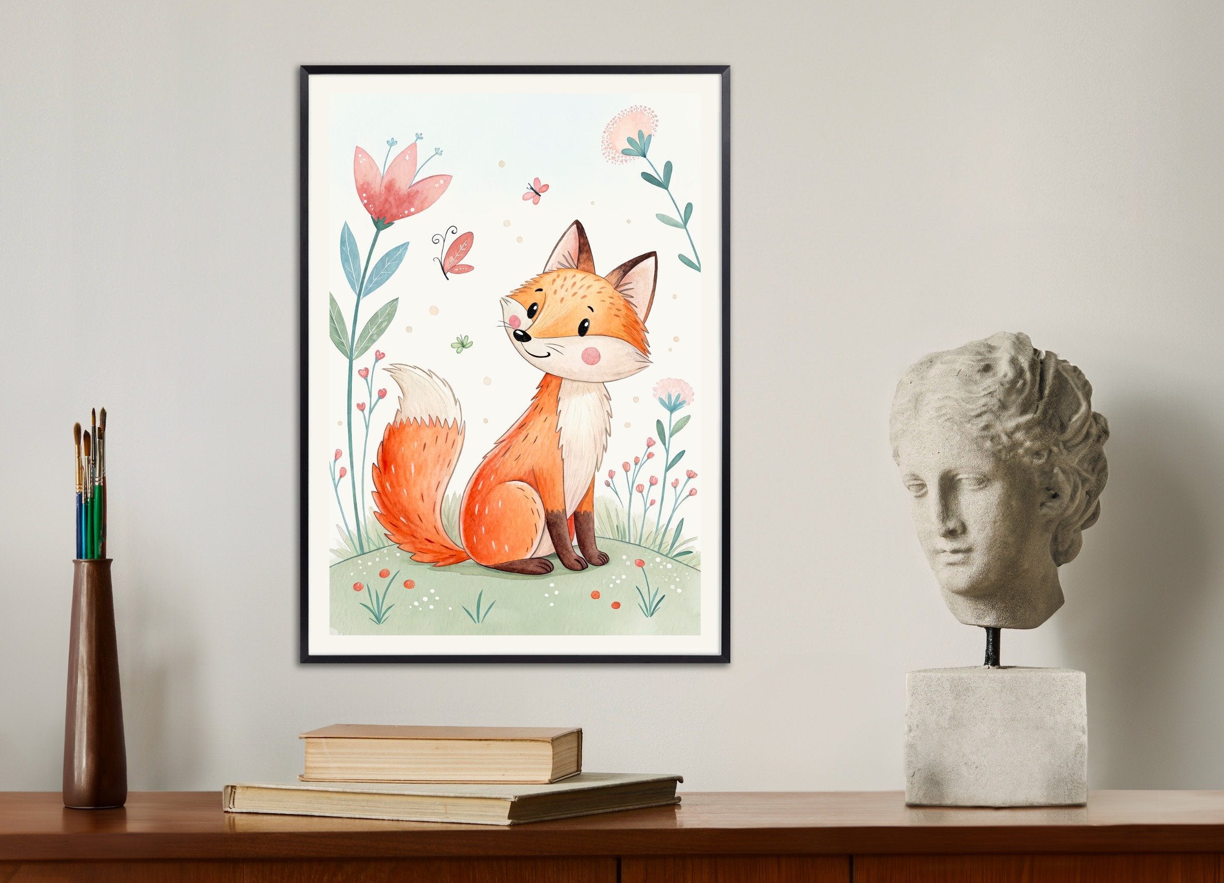 Framed illustration of a fox surrounded by flowers on a shelf with books and a statue.