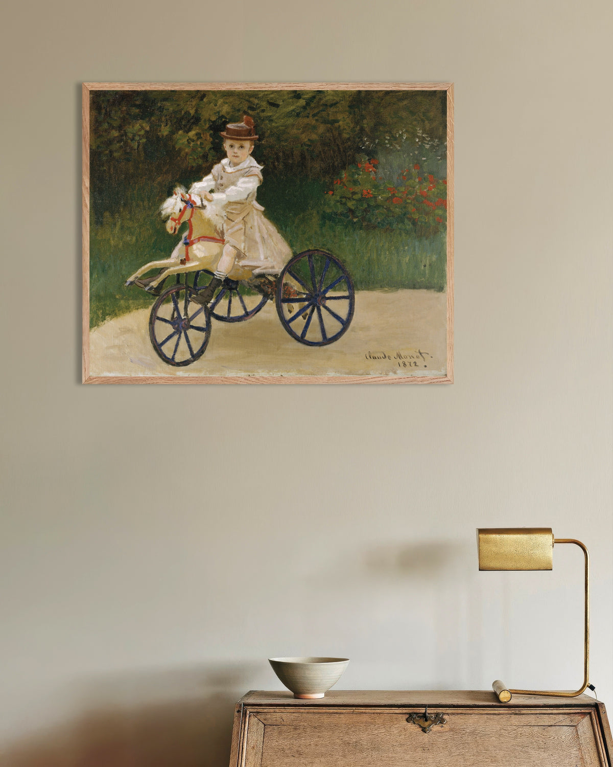 Poster Jean Monet auf seinem Steckenpferd (1872) von Claude Monet mit naturfarbenem Holzrahmen