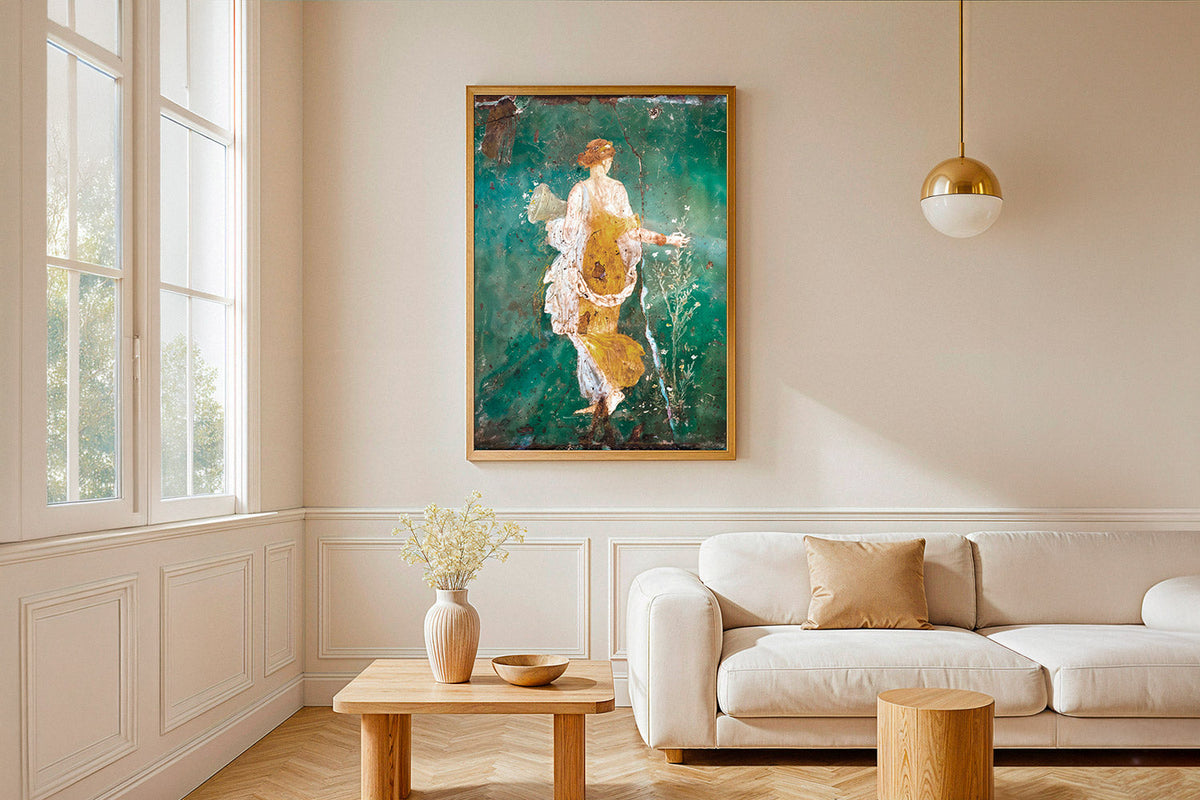 Flora fresco from Stabiae poster in an oak frame above a cream sofa in a bright living room